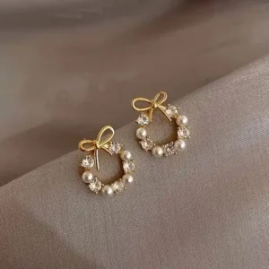 Boucles d'oreilles - Brillantes - Nœud - Perles d'imitation - Strass - Métal doré et blanc