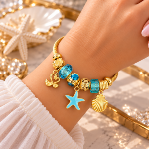 Bracelet Femme Doré à Breloques Marines Bleues – Étoile de Mer & Cygnes