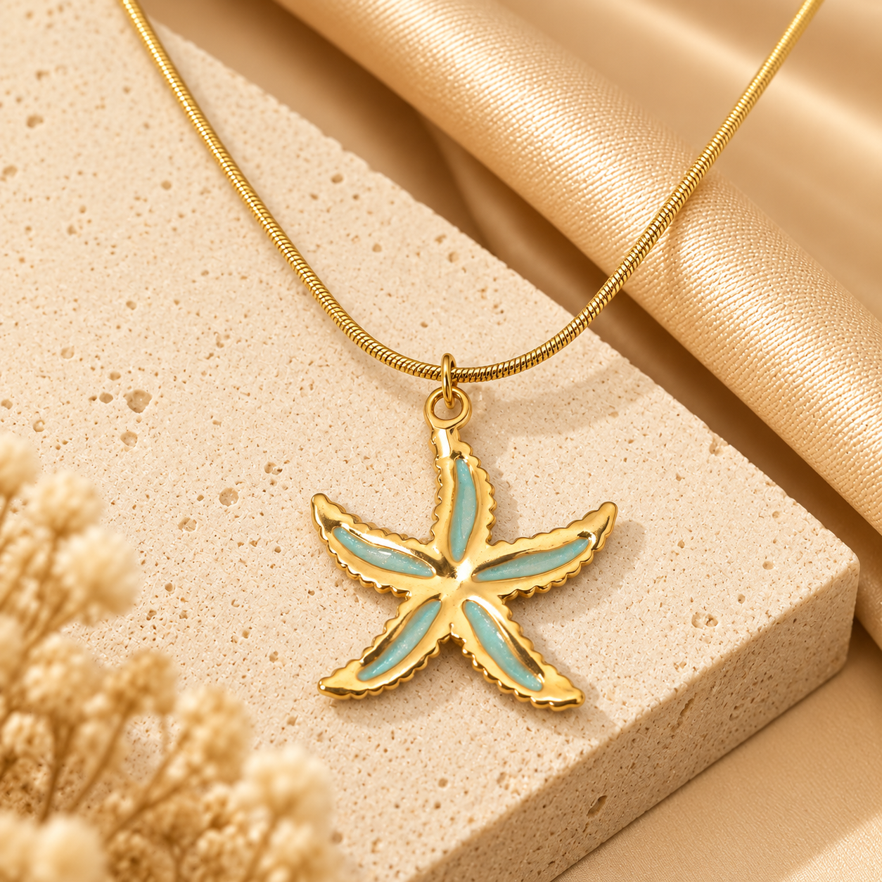 Pendentif étoile de mer doré précieux